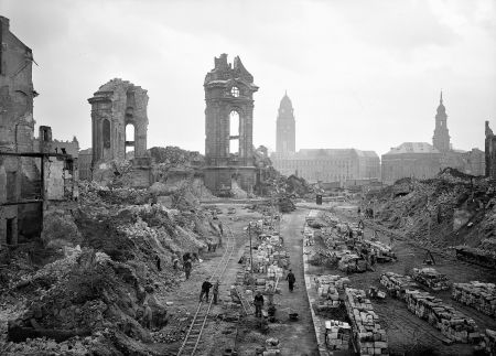 View taken in January 1952 from Dresden's Muenzgasse street showing people working on the removal of debris in front of the ruins of the Frauenkirche (Church of Our Lady). The 18th century Protestant church, a searing symbol of the suffering of German civilians after its destruction in World War II bombing and now of reconciliation between the one-time enemies, has been re-consecrated on 30 October 2005 after over 10 years of reconstruction costing some EUR 180 million.  AFP PHOTO      SLUB DRESDEN/Deutsche Fotothek (Photo credit should read SLUB DRESDEN/AFP/Getty Images) BER022